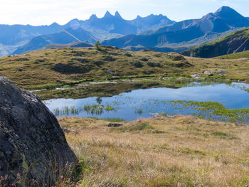 Scenic view of lake against mountain range