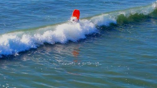 People surfing in sea