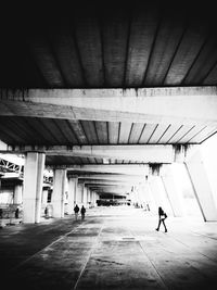 People in illuminated tunnel