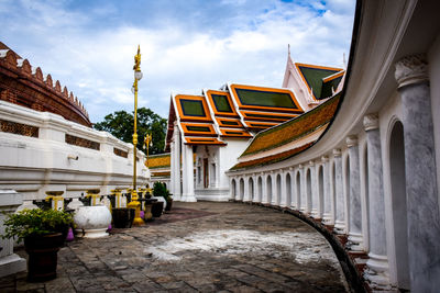 Corridor of historic building against sky