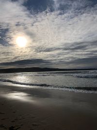 Scenic view of sea against sky at sunset