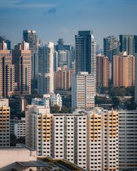 Modern buildings in city against sky