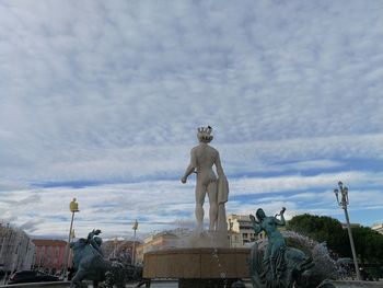 Low angle view of statue against sky