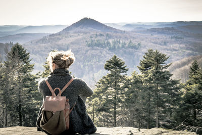 Rear view of woman looking at mountains