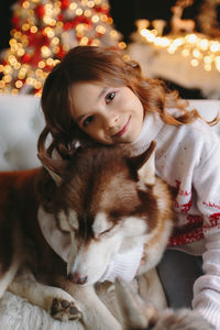 Portrait of young woman with dog