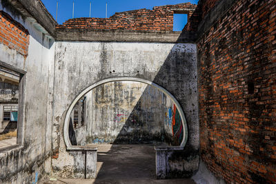 Graffiti on wall of old building