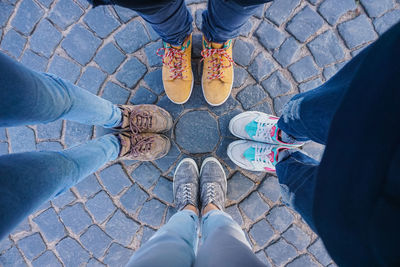 Low section of people standing on footpath