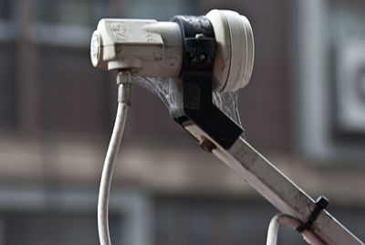 Close-up of faucet against blurred background