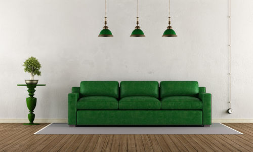 Green sofa and pendant lights at home
