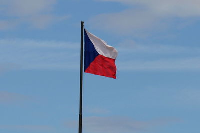 Low angle view of flag against sky