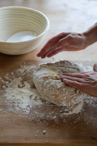 Midsection of person preparing food on table