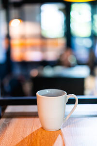 Close-up of coffee cup on table