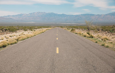 Road amidst landscape against sky