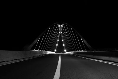 Illuminated road bridge at night