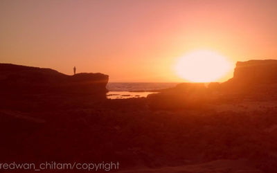 View of beach at sunset