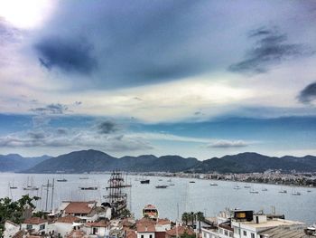 Scenic view of mountains against cloudy sky