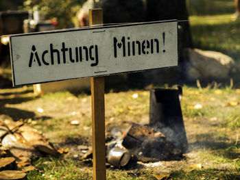 Close-up of warning sign on field