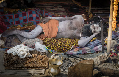 View of sleeping in traditional clothing