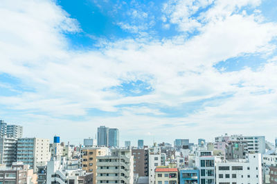 Buildings in city against sky