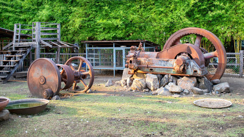 Old rusty wheel on field