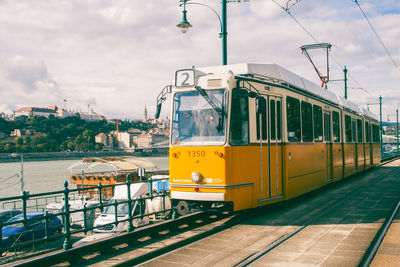 Tram against sky in city