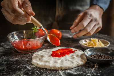 Midsection of man preparing food