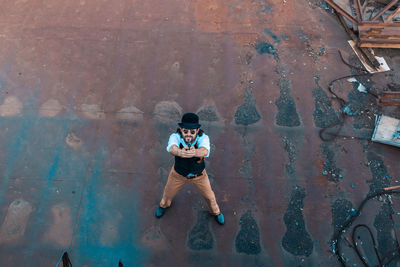 High angle view portrait of child on wall