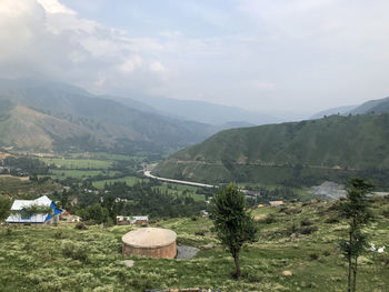 Scenic view of landscape and mountains against sky