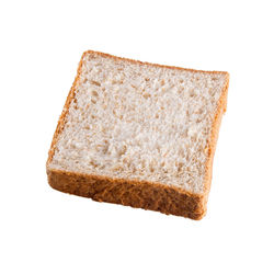 Close-up of bread against white background