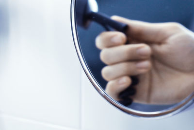 Close-up of man holding camera