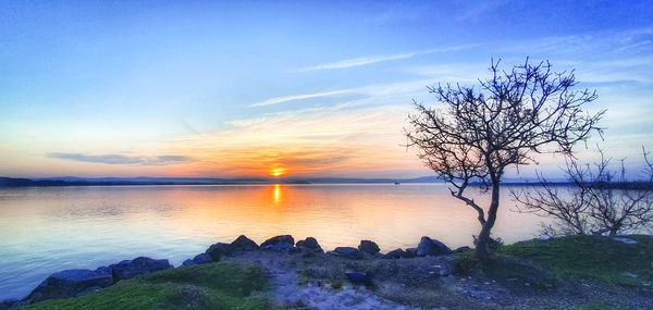 Scenic view of sea against sky during sunset