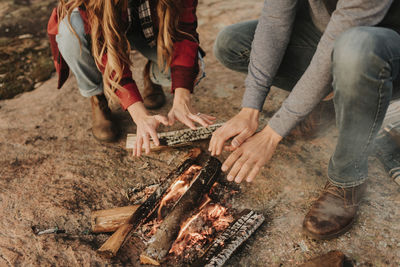 Low section of people relaxing on ground