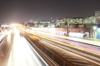 Light trails on road in city at night