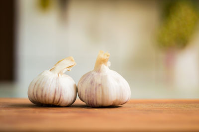 Close-up of garlics on table