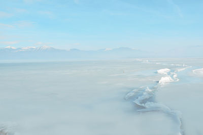 Huge crack in the surface of the frozen lake orestiada in kastoria , greece