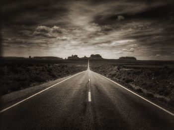 Road amidst landscape against sky