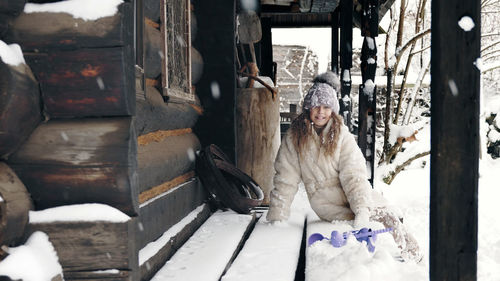 Winter portrait. pretty little girl, dressed in warm winter clothes, fully covered with snowflakes