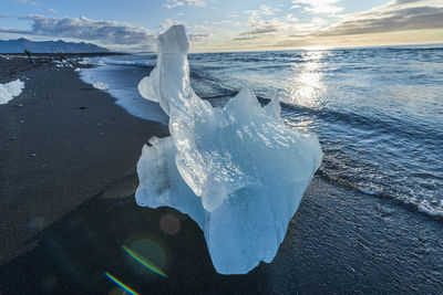 Ice formations on beach during sunrise, vestmannaeyjar, iceland, southern region