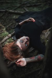 Portrait of young woman lying down