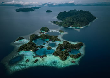 High angle view of rocks on sea against sky sombori island