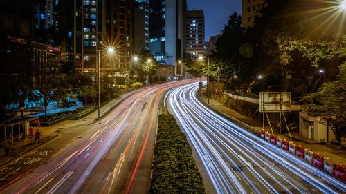 Illuminated city street at night