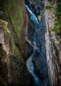 High angle view of water flowing through rocks