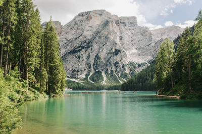 Scenic view of lake and mountains against sky