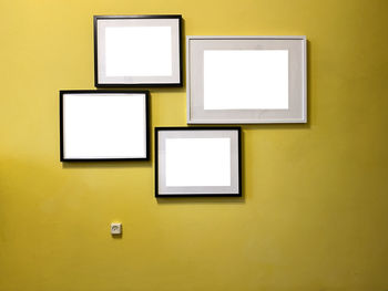 Low angle view of yellow paint on wall at home
