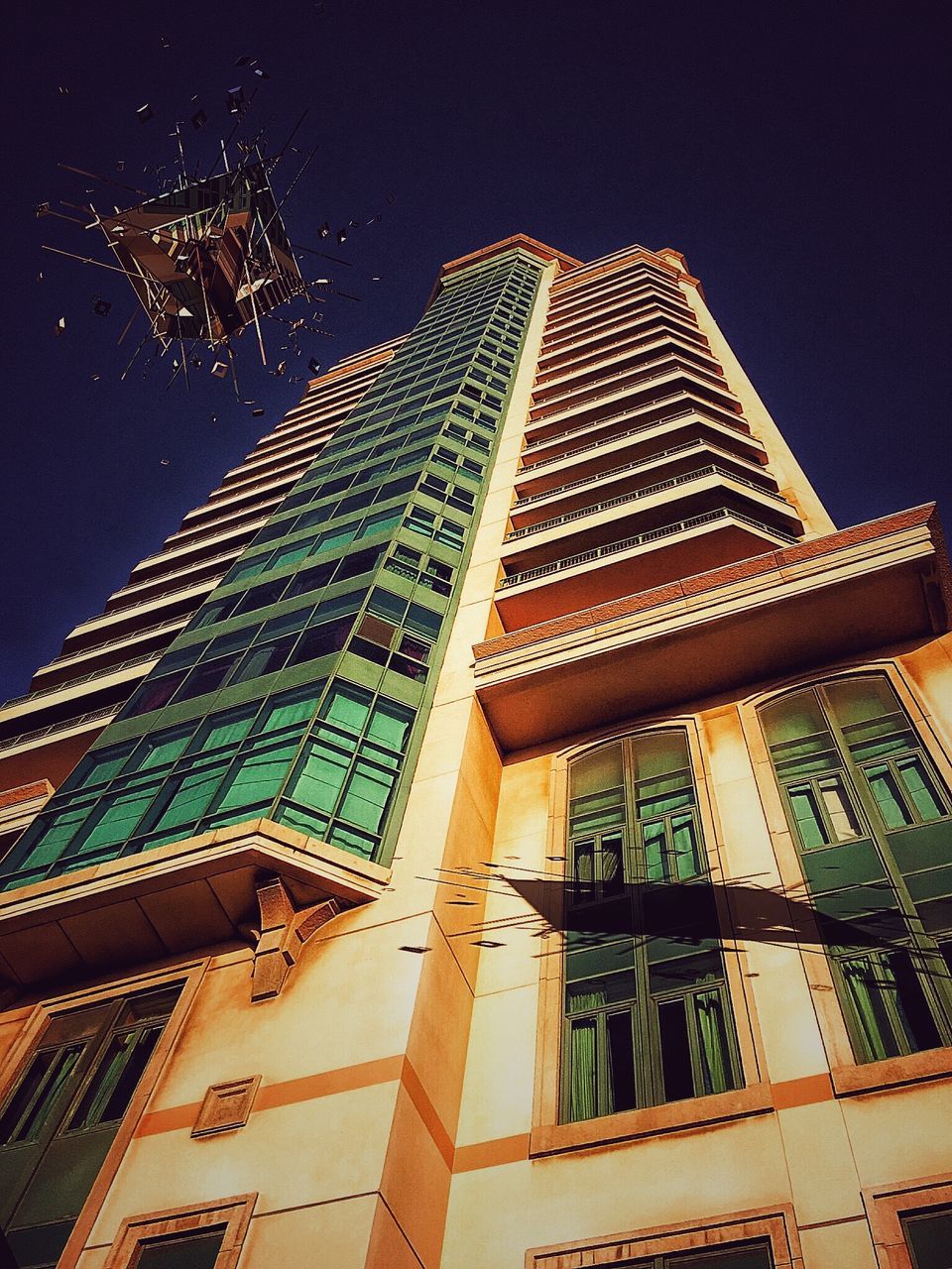 low angle view, architecture, built structure, building exterior, night, tree, building, modern, illuminated, city, clear sky, tall - high, office building, sky, window, tower, skyscraper, outdoors, growth, no people