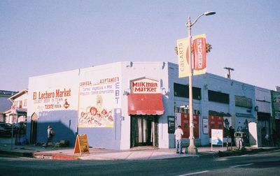 Information sign in city against clear sky