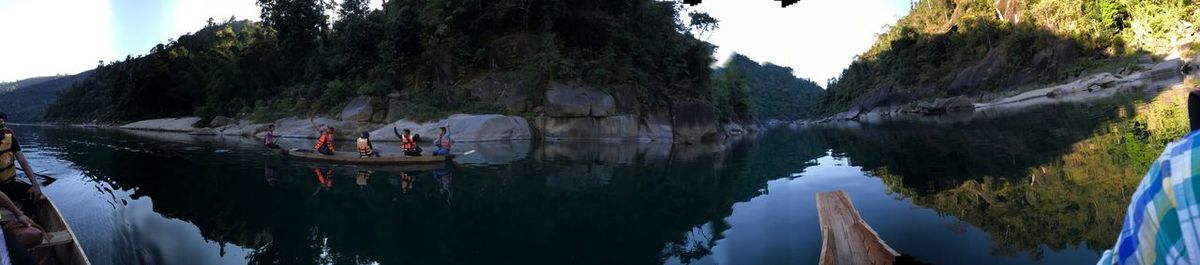 Panoramic view of lake and trees against sky