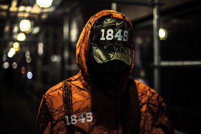 Close-up of man standing at night