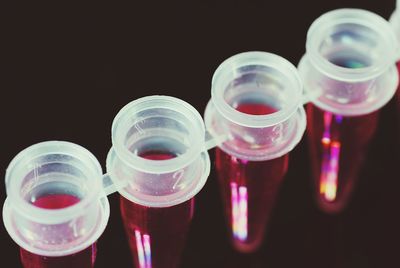 Close-up of multi colored glass against black background