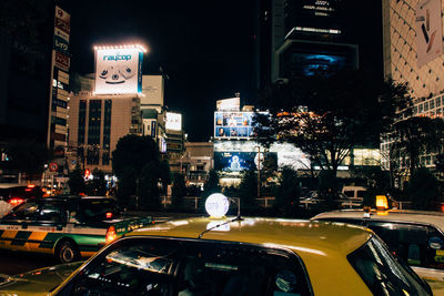 Illuminated city street at night
